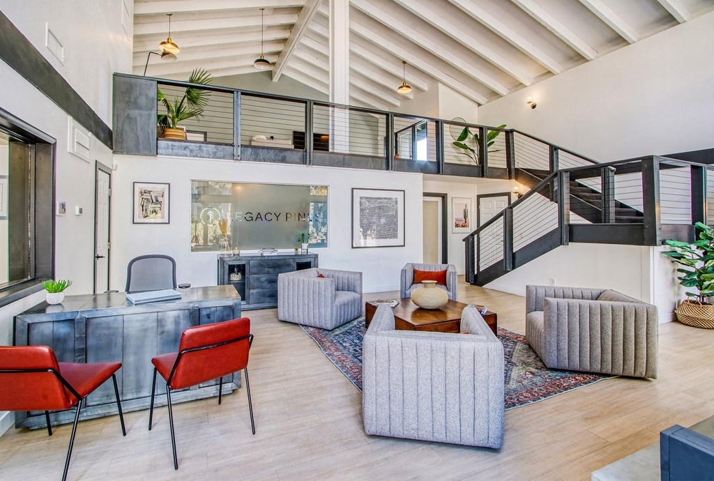 a living room with furniture and a staircase