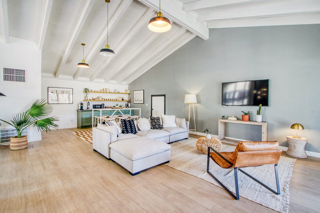 a living room with a couch and a tv