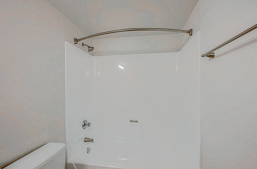 a bathroom with a shower and a tub