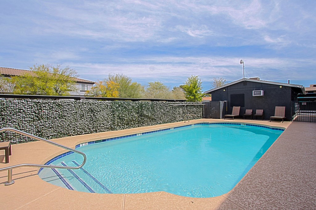 a resort style swimming pool at the enclave at woodbridge apartments in sugar land, tx