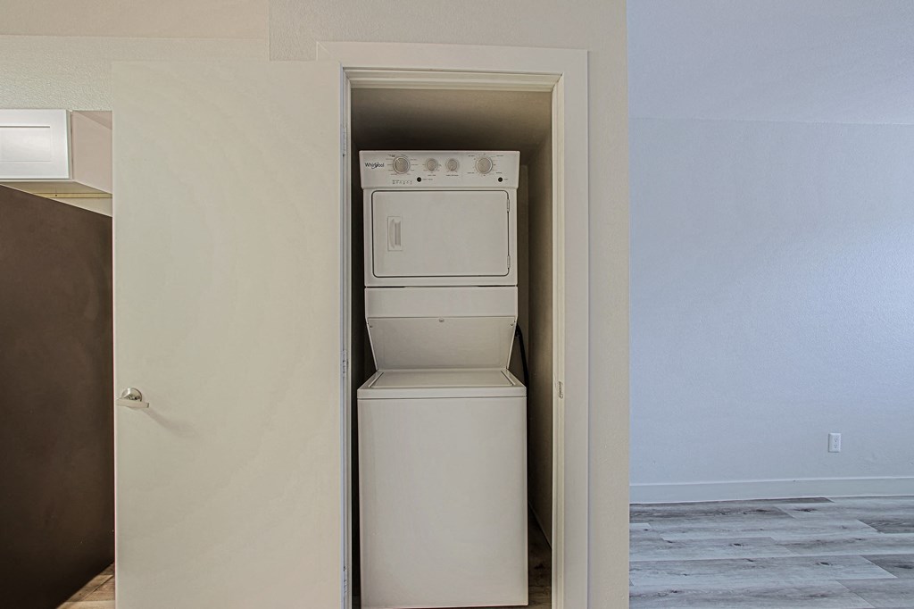 a room with a washer and dryer in it