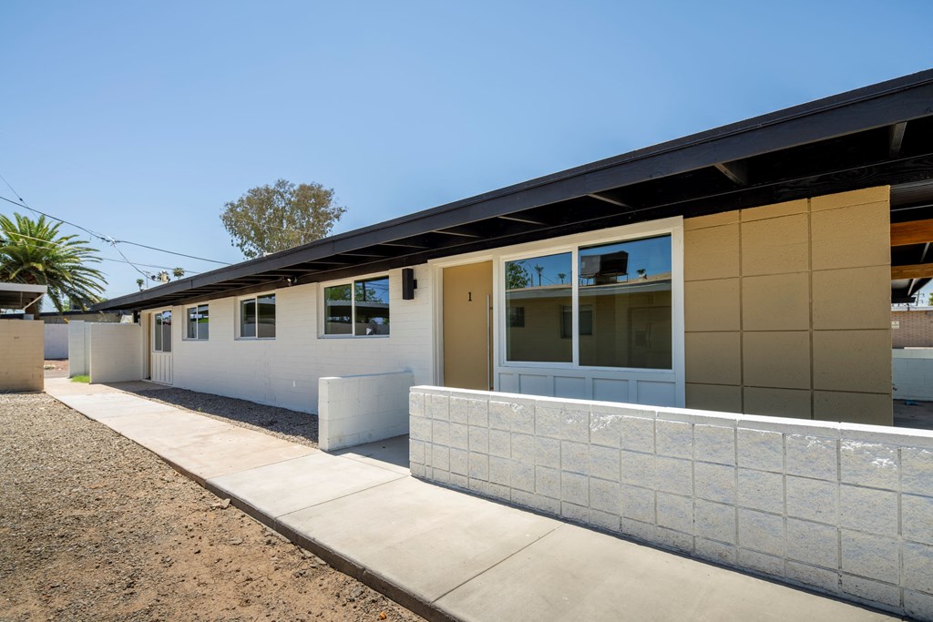 a view of the back of the building from the sidewalk