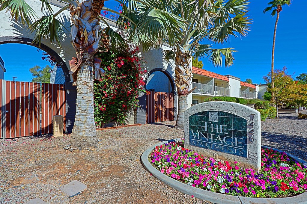 A sign that says "The Vintage" in front of a building.