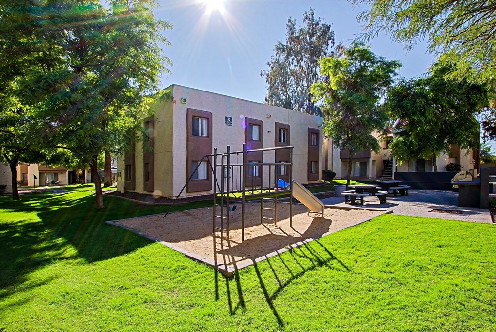 a building with a playground in front of it