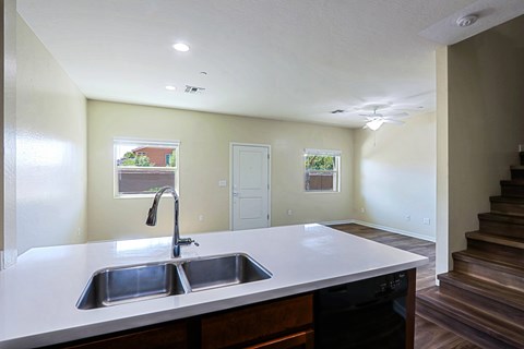 A kitchen with a sink and a window.
