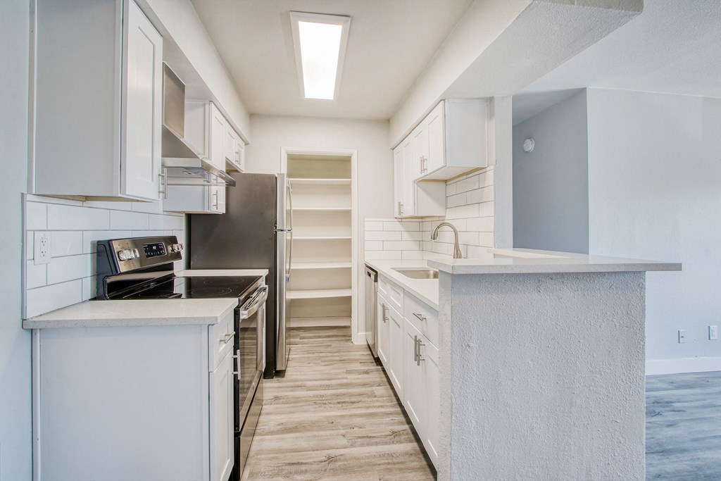 the preserve at ballantyne commons apartment kitchen with island and stainless steel appliances