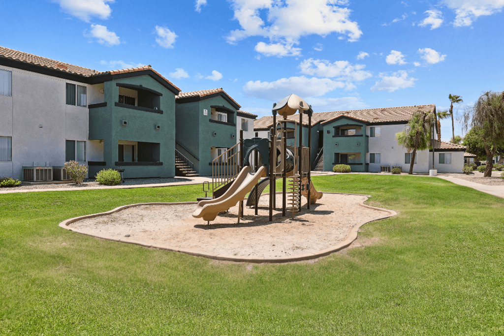 a playground at the whispering winds apartments in pearland, tx