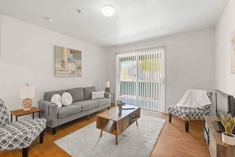 a living room with a couch and a table