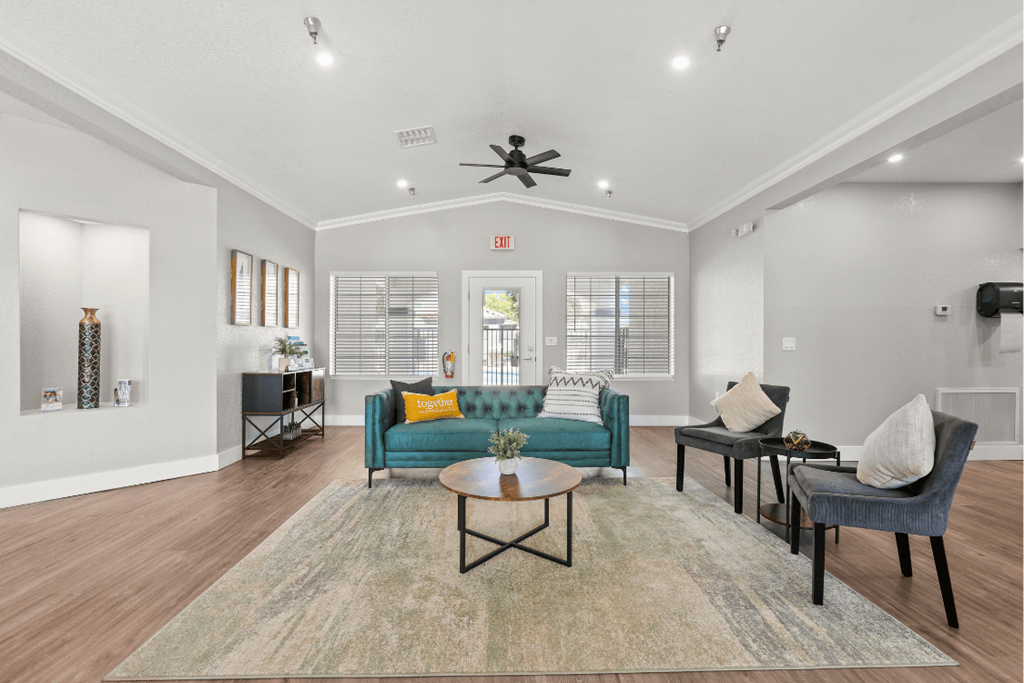 a living room with couches chairs and a coffee table