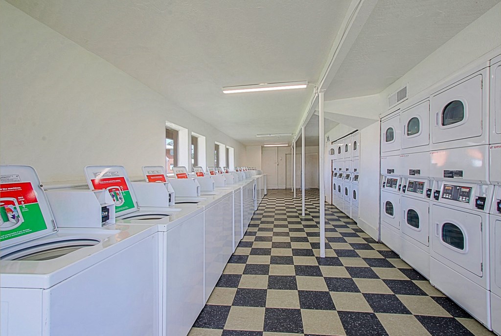 a row of washing machines in a laundromat