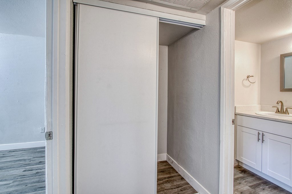 an empty bathroom with a sink and a mirror