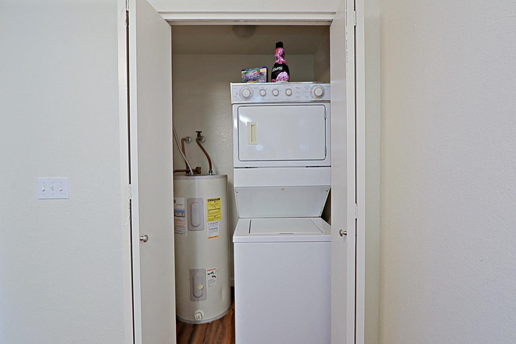 a small laundry room with a washer and dryer
