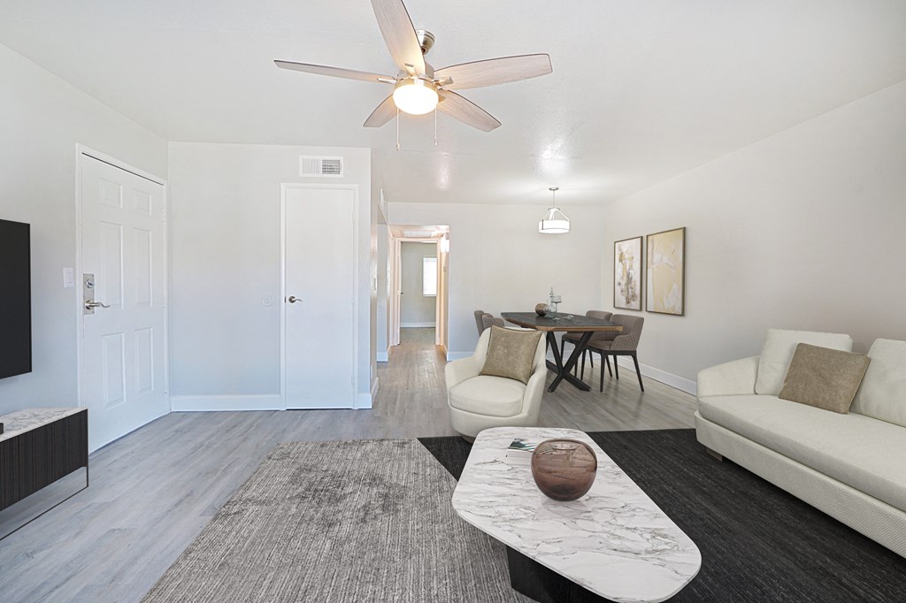 a living room with a couch and a coffee table and a tv