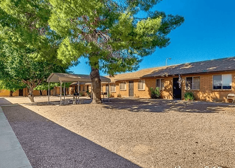 a building with a tree in front of it