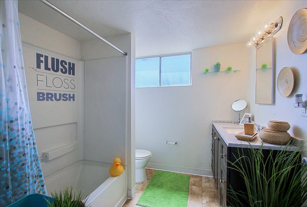 a bathroom with a bathtub and a sink