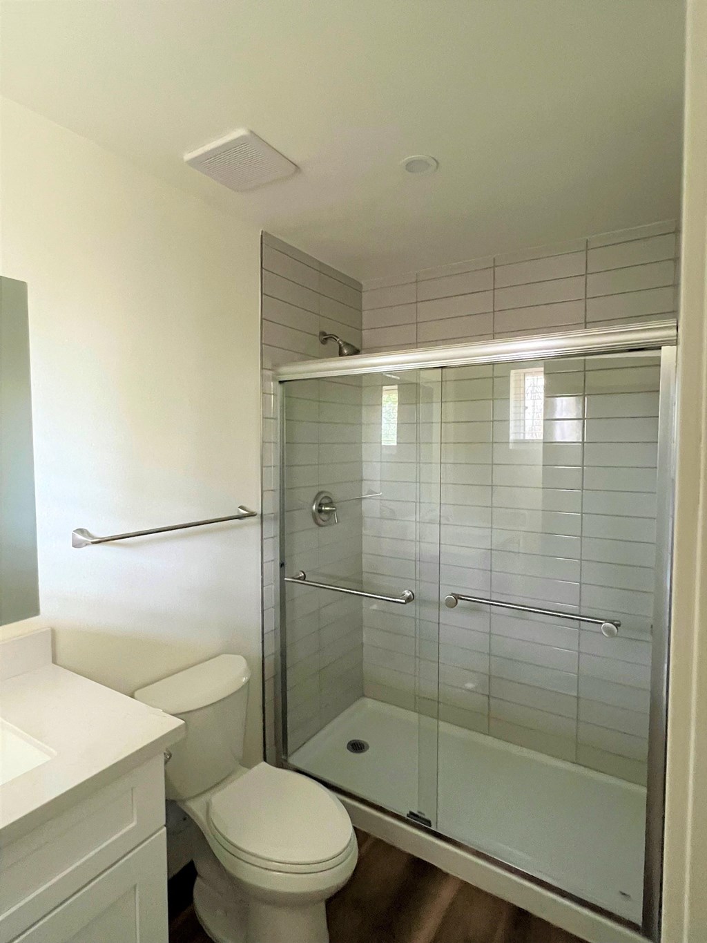 a small bathroom with a toilet and a shower