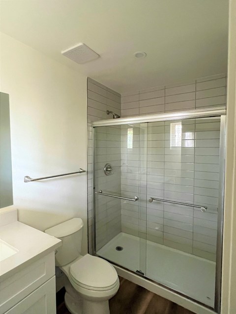 a small bathroom with a toilet and a shower