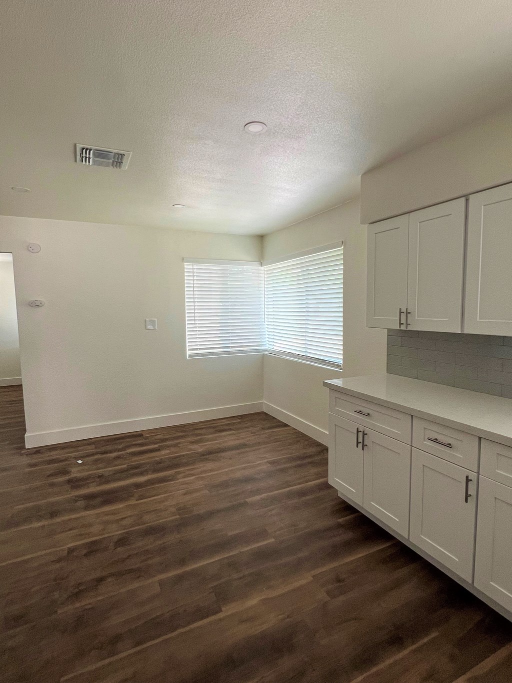 a photo of the kitchen and living room of a 560 square foot, 1 bedroom apartment at