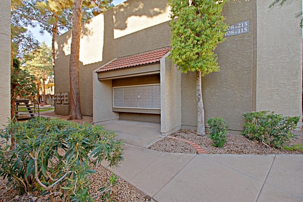 a garage with a tree in front of it