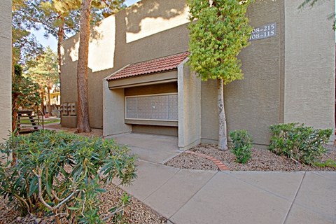 a garage with a tree in front of it