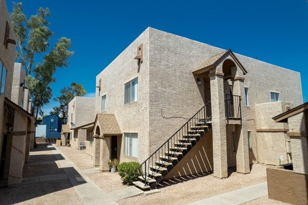 A building with a staircase leading to the second floor.