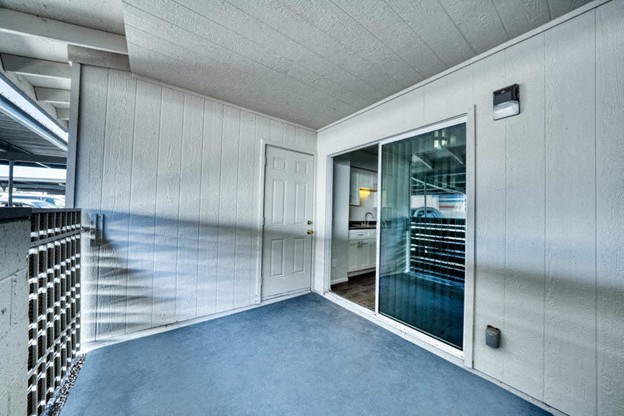 A room with a white wall and a glass door. at Connect on University, Mesa, AZ, 85203