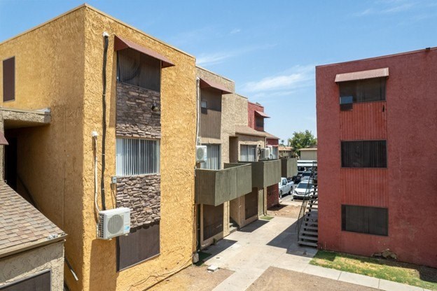 A row of buildings with a clear blue sky above them.