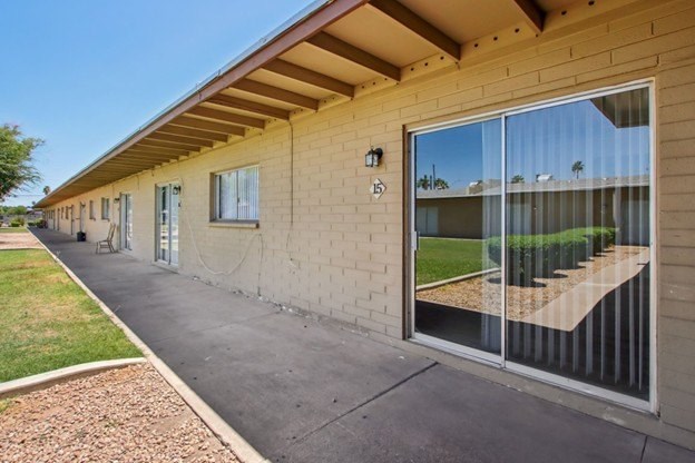 A long building with a lot of windows and a balcony.
