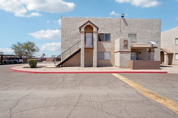 A building with a red circle in front of it.