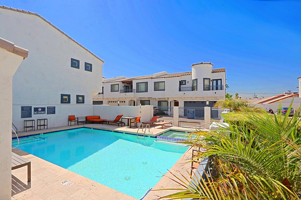 A pool in a sunny backyard.