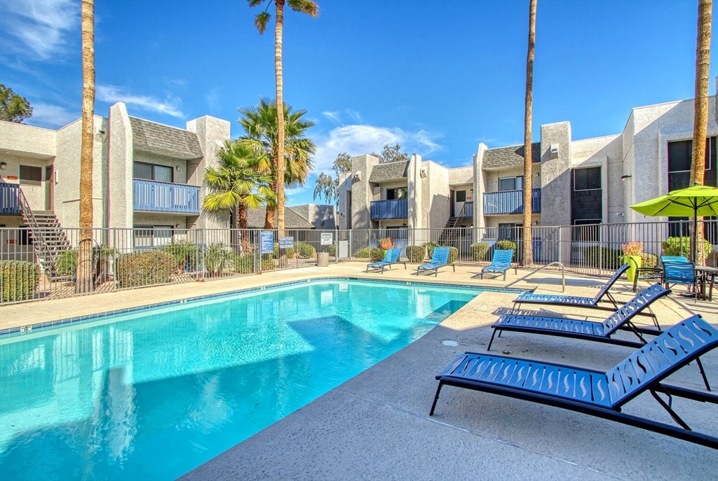 our apartments have a resort style pool and lounge chairs