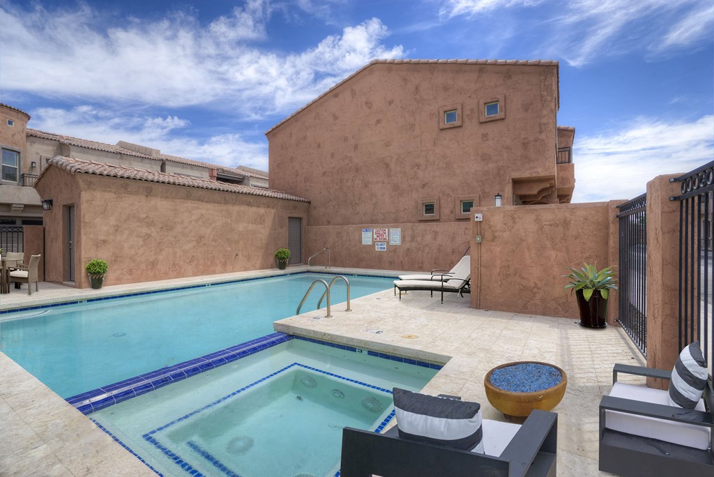 a swimming pool in the backyard of a building