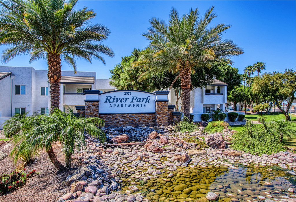 the preserve at river park apartments sign in front of palm trees