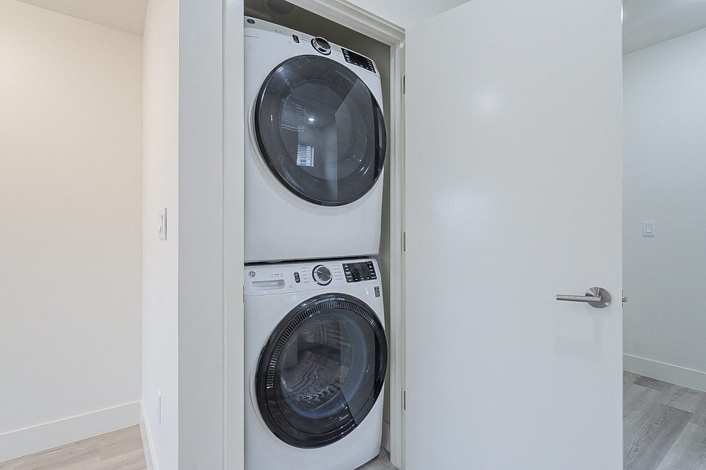 a small laundry room with a washer and dryer