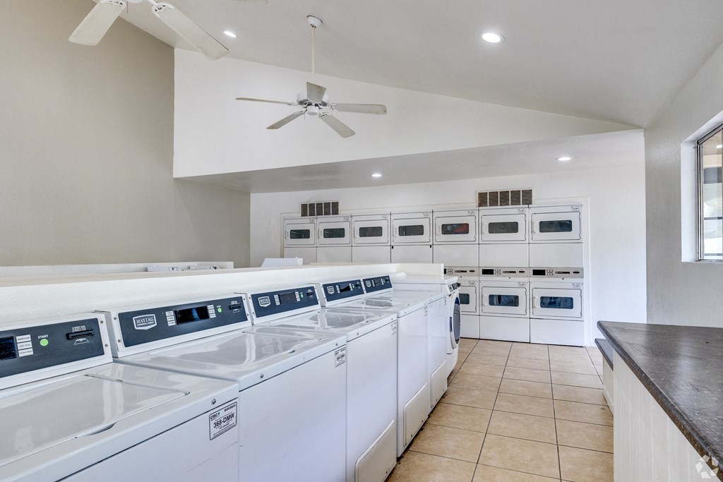 the laundry room has plenty of washes and dryers