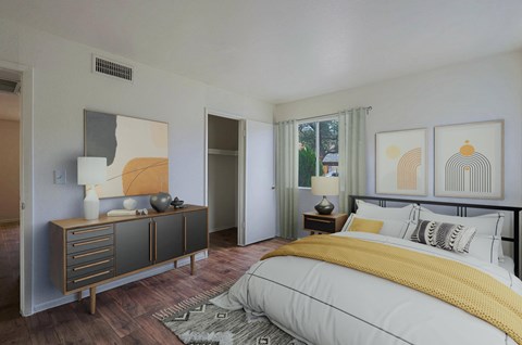 A bedroom with a large bed and a wooden cabinet.