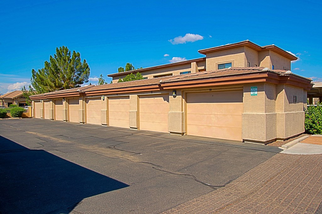 a row of automated garage doors in front of a building