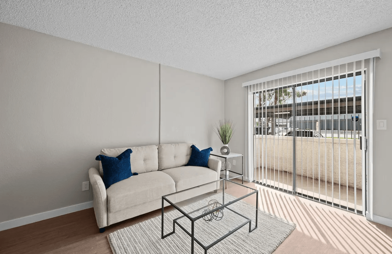 Furnished apartment living area shown — representative home at Tides on McDowell.