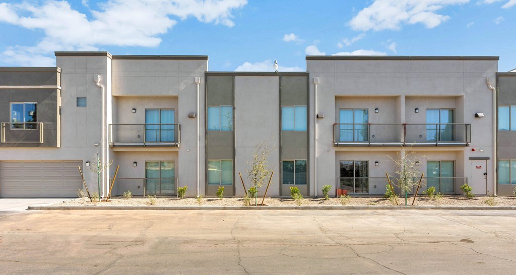 a building with a parking lot in front of it at Allora Phoenix Apartments, Phoenix, Arizona