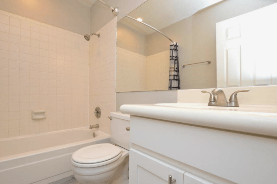 a bathroom with a toilet sink and bathtub