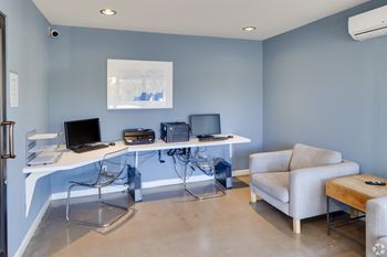 A room with a desk, chairs, and a couch. at The Viridian Apartments, Scottsdale, AZ, 85250