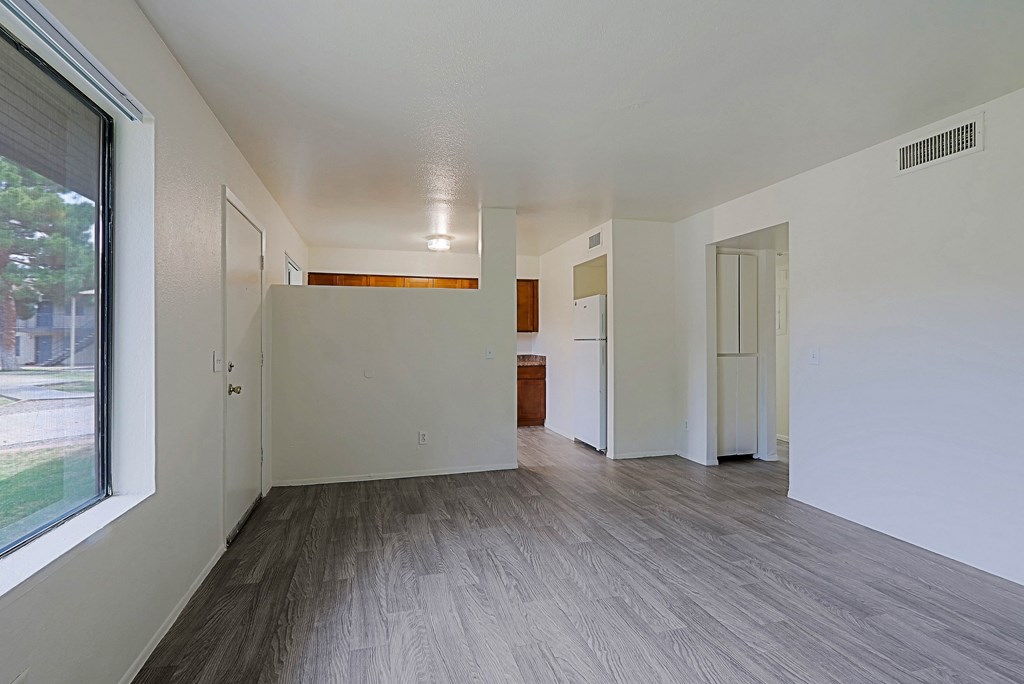 A room with a window and a door.