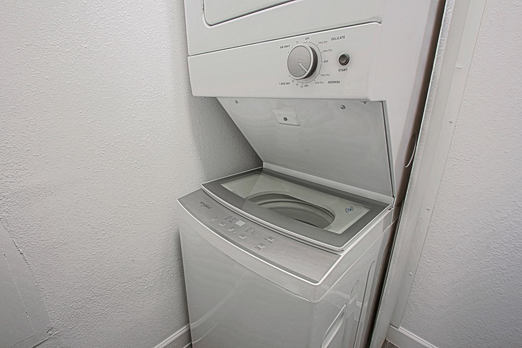 the laundry room has a washer and dryer and a sink