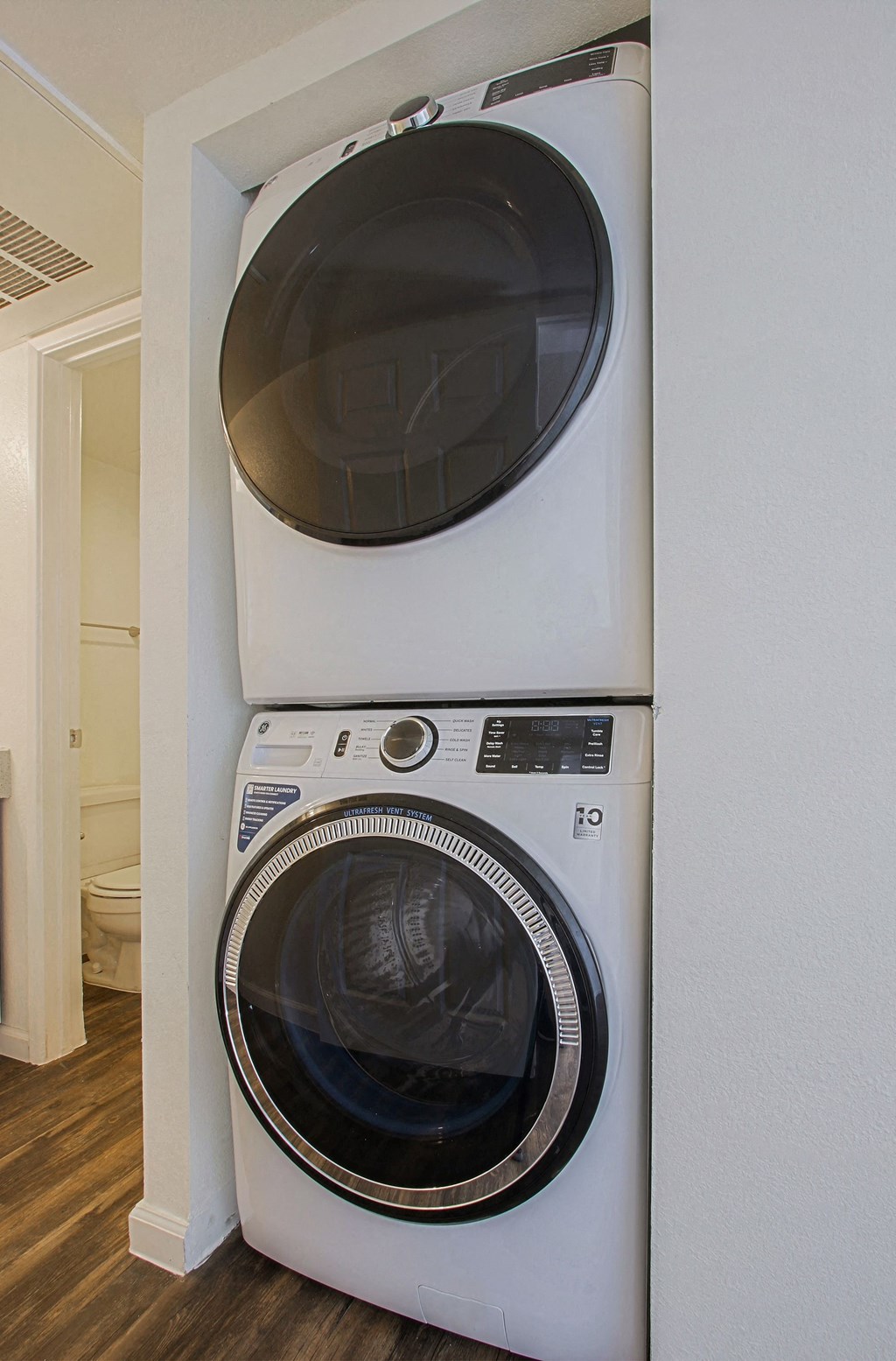 a washer and dryer stacked on top of each other in a laundry room