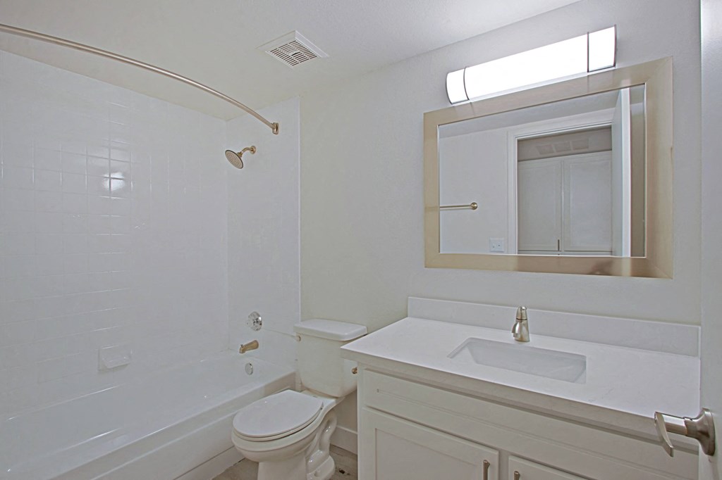 a bathroom with a sink toilet and bathtub