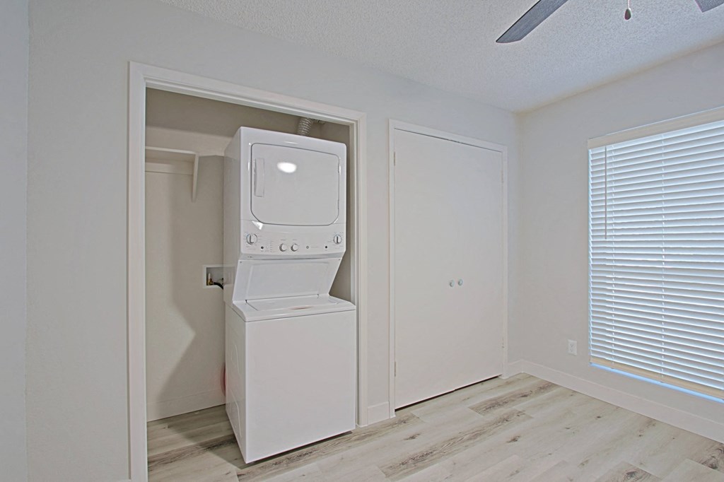a small laundry room with a washer and dryer