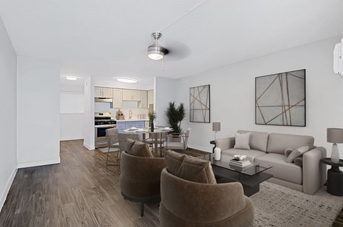 A living room with a brown chair and a grey couch.