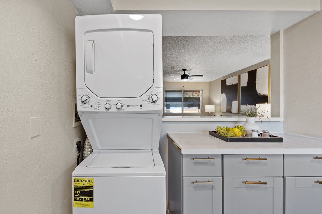 A white oven with a sticker on it in a kitchen.