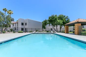 Large soothing swimming pool with wood-look cabana at Tides at Mesa, Mesa, 85204
