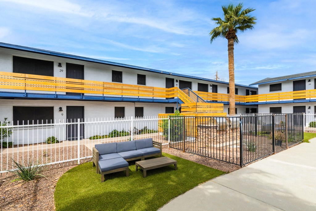 A building with a palm tree in front of it.